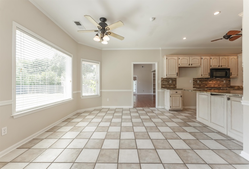 Spacious interior with checkerboard tile flooring