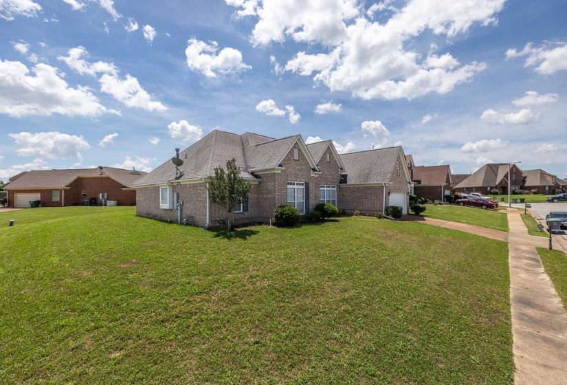 Brick exterior home featuring a gabled roofline and an attached garage
