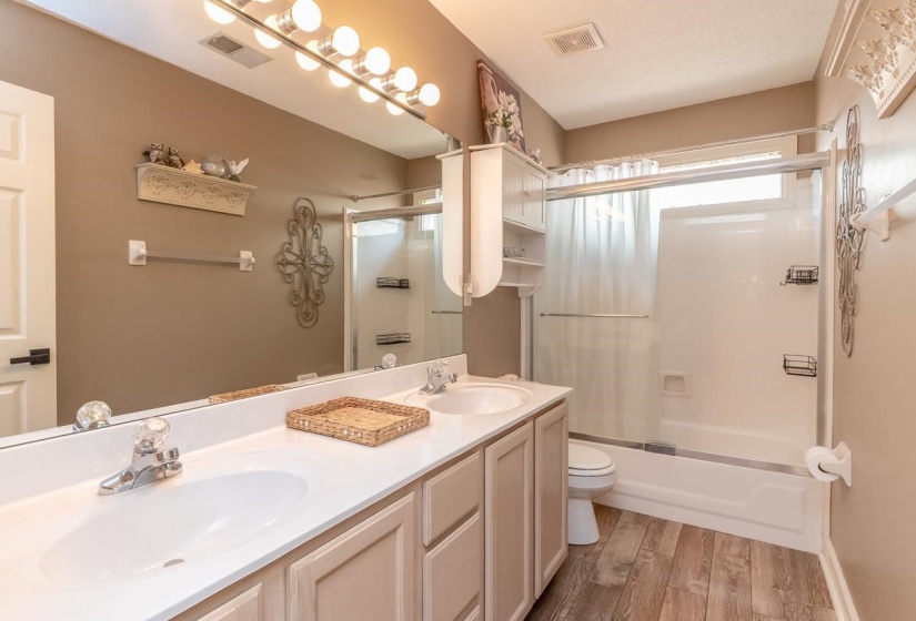Dual vanity with integrated sinks and white countertops