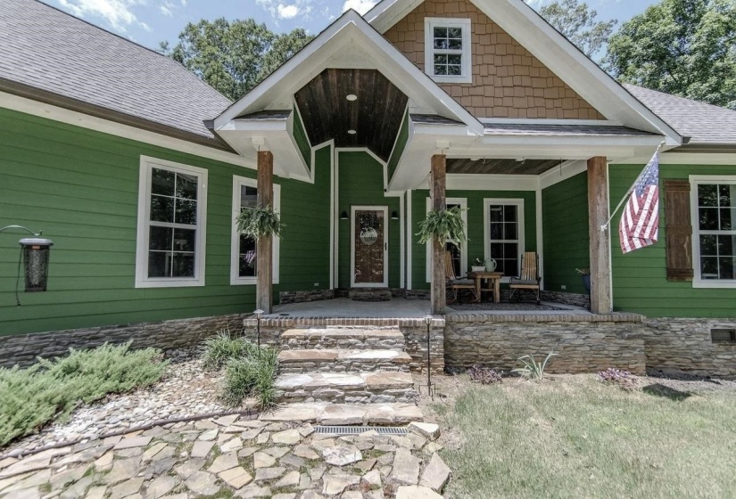 Craftsman-style home featuring a prominent covered front porch with exposed wood columns