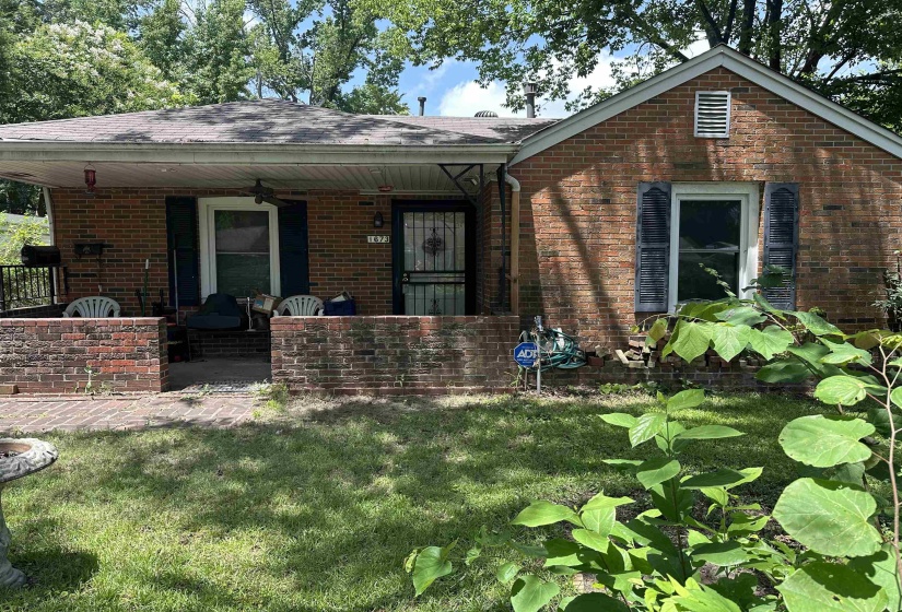 Brick exterior with a covered front porch and a gabled roofline