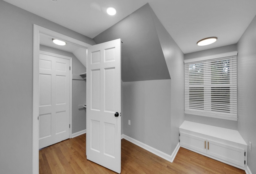 Spacious closet with light wood finished floors
