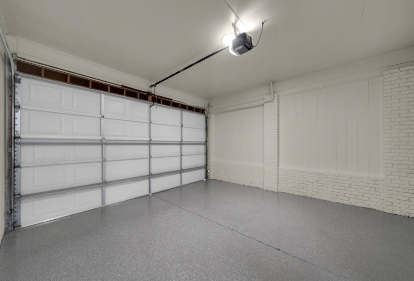 Garage featuring a garage door opener