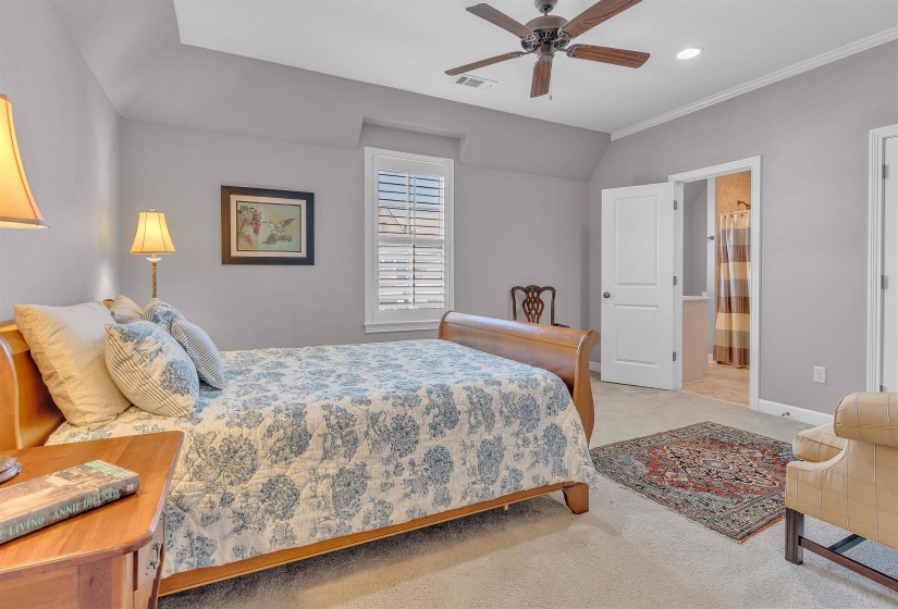 Carpeted room with a ceiling fan, recessed lighting, and white plantation shutters