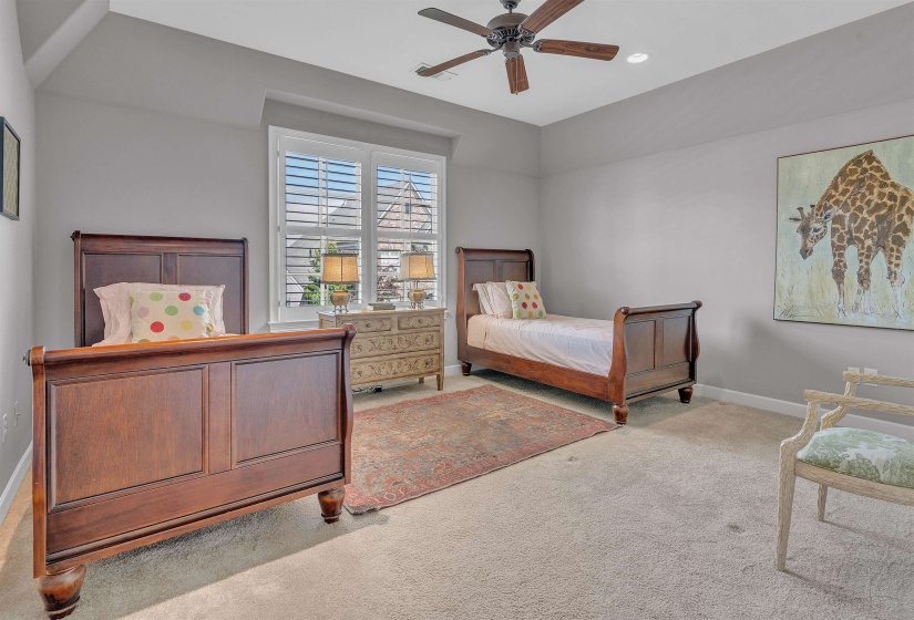 Spacious room with a ceiling fan, recessed lighting, and neutral-toned carpet flooring