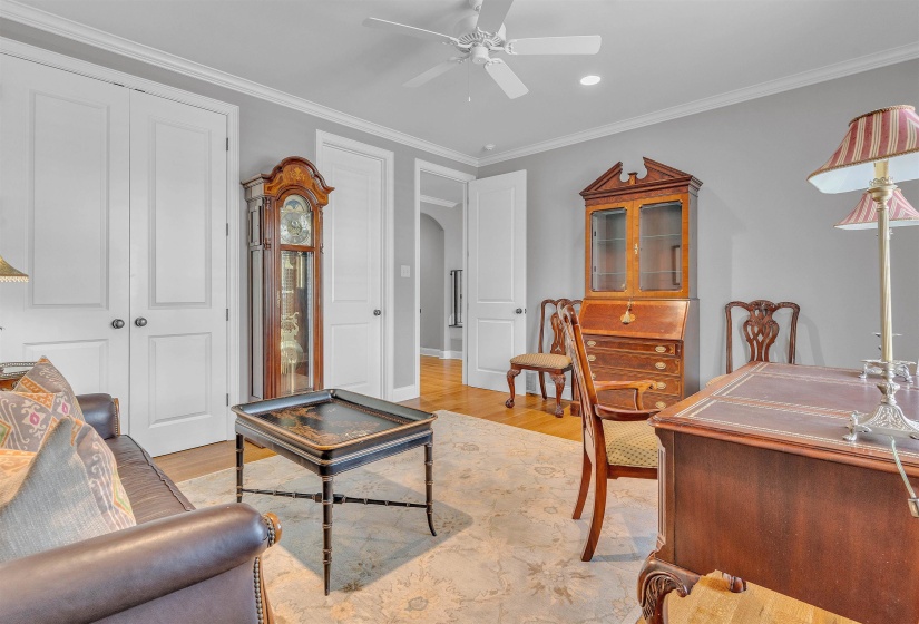 Interior space featuring light gray walls, white trim, and light wood-finish flooring