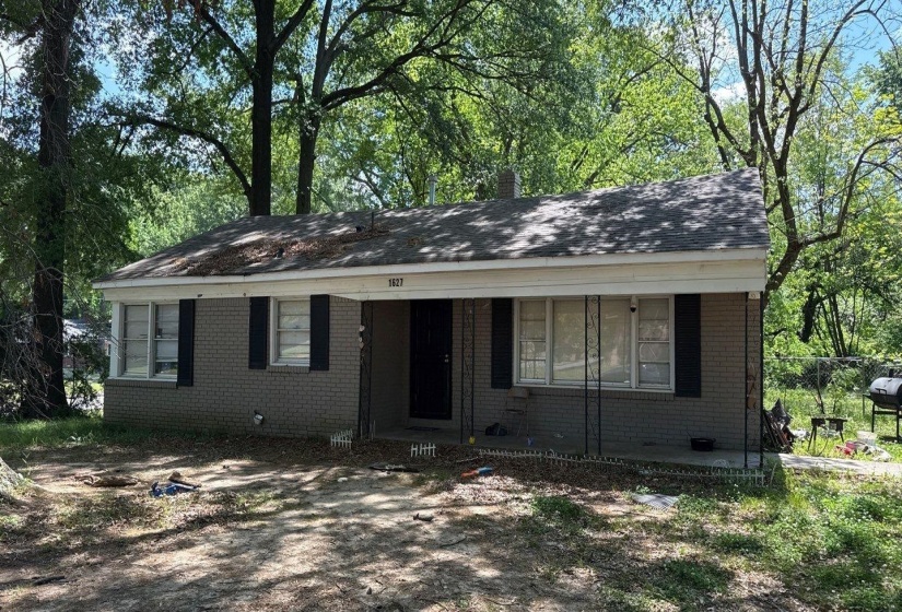 Single-story residence featuring a brick exterior and a gabled roof