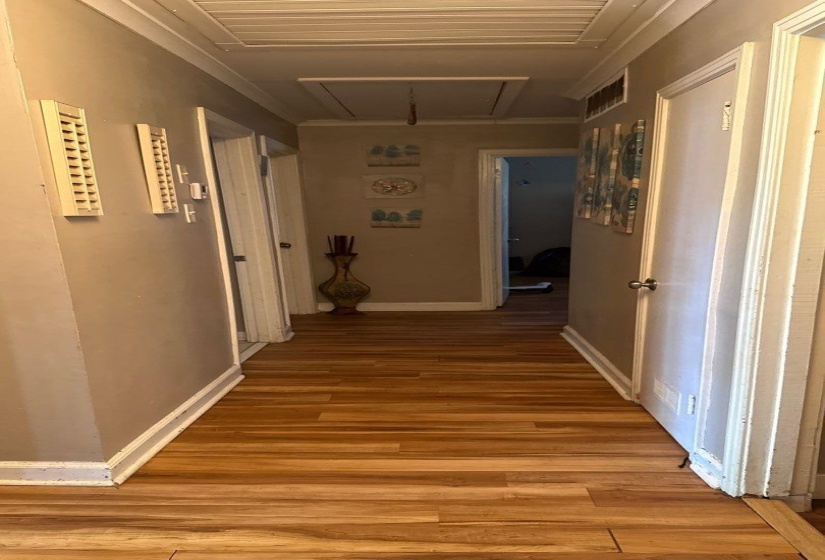 Hallway with wood-finish flooring