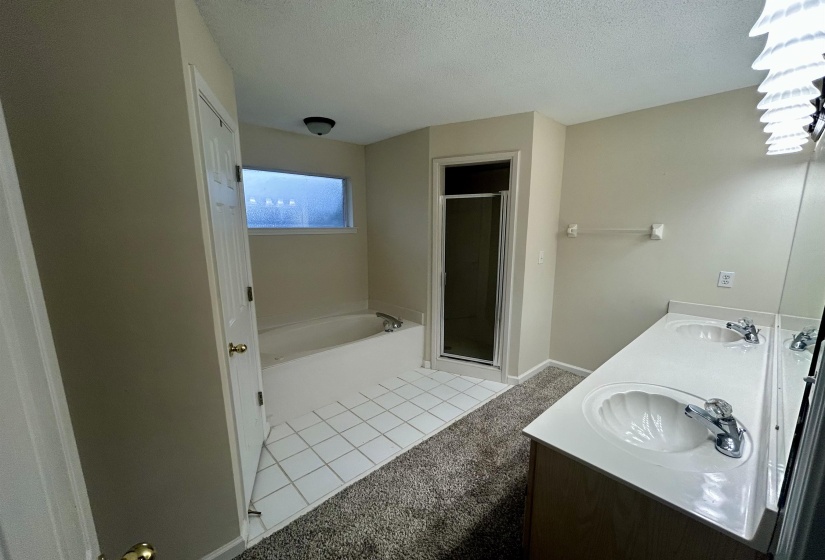 Bathroom with dual vanity featuring integrated sinks