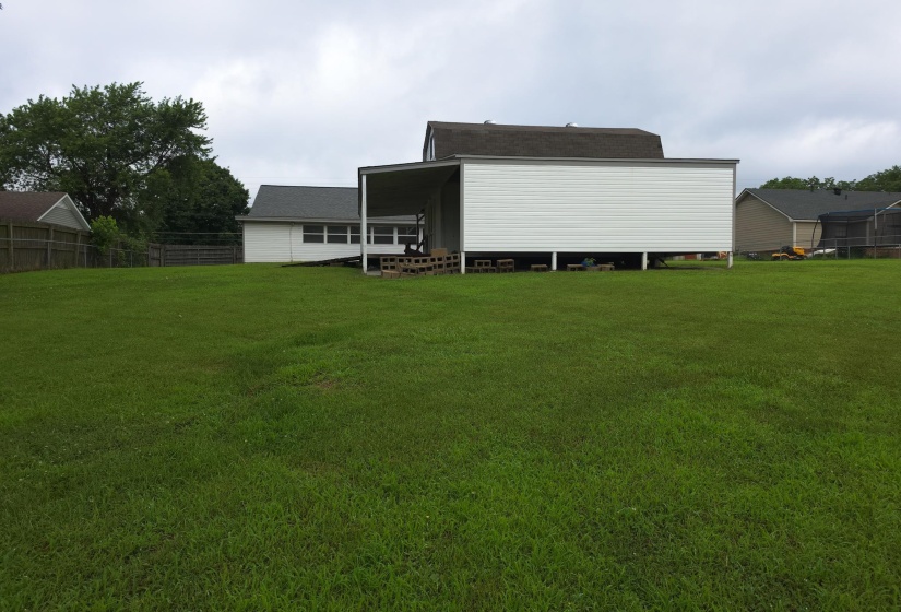 Expansive green lawn providing ample outdoor space
