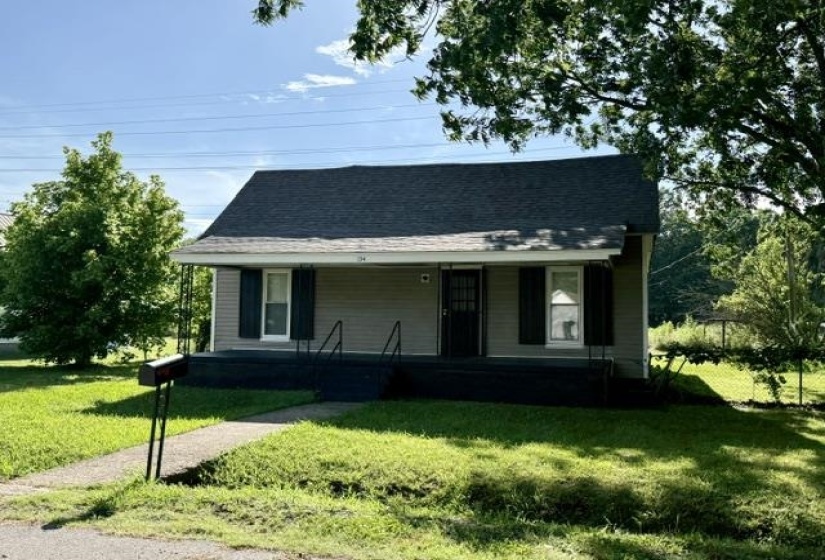 Exterior facade featuring horizontal siding, a covered front porch, and an asphalt shingle roof