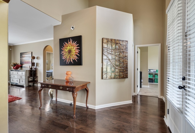 Rich wood-finish flooring throughout, complemented by neutral wall tones