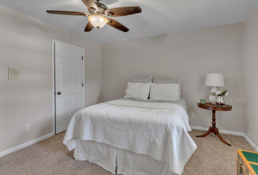 Carpeted flooring with light neutral wall tones