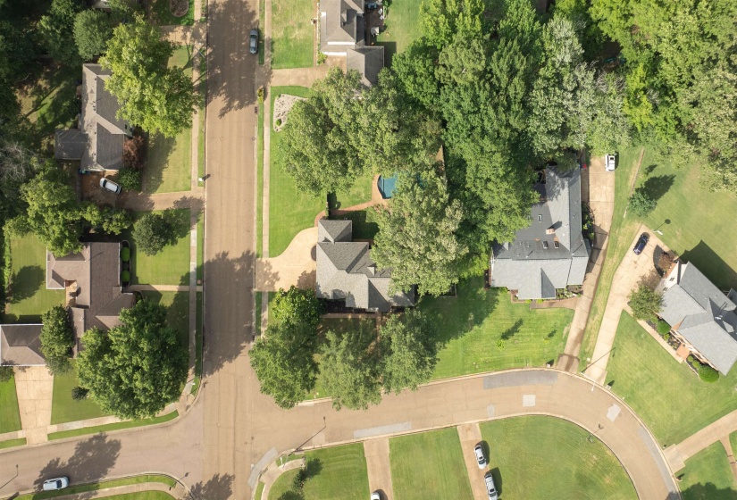 Aerial perspective showcasing a residential property with a private swimming pool