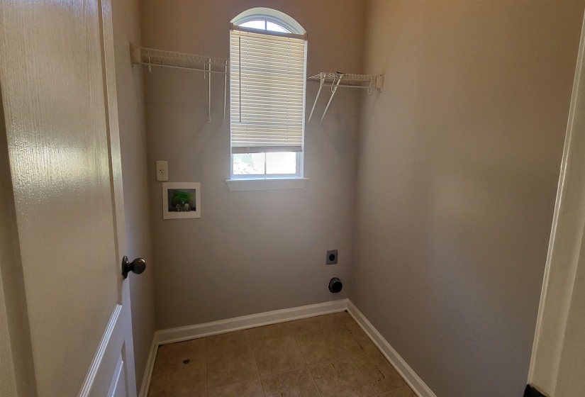 Clothes washing area with hookup for an electric dryer and hookup for a washing machine