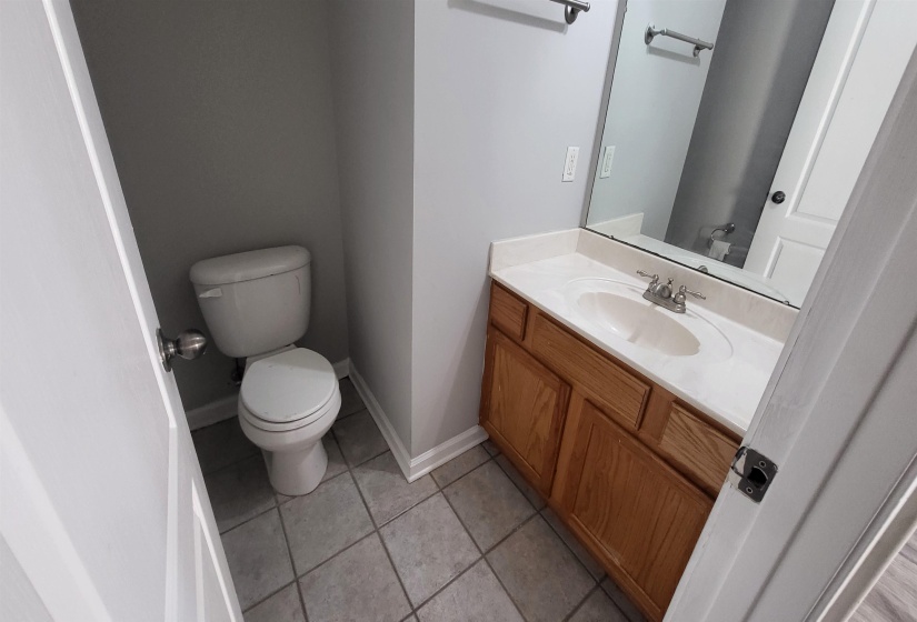 Bathroom with tile patterned floors, vanity, and toilet