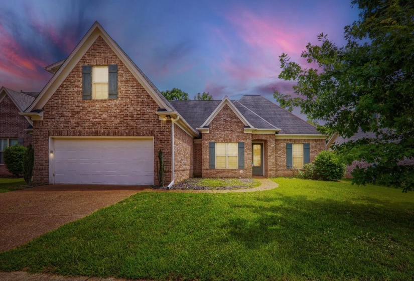 Brick exterior featuring a gabled roofline and shutters