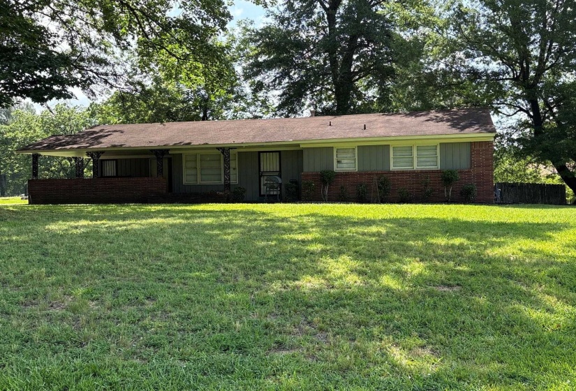 Ranch-style exterior featuring brick and siding construction