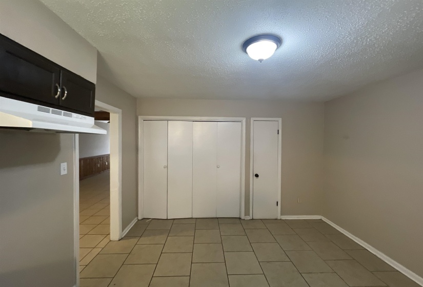 Neutral-toned tile flooring throughout