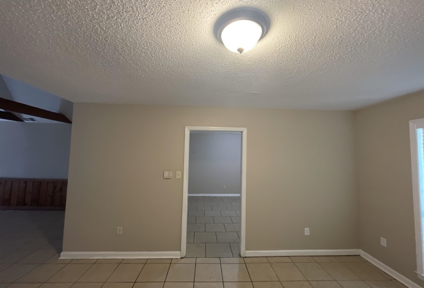 Neutral-toned walls complement the light tile flooring