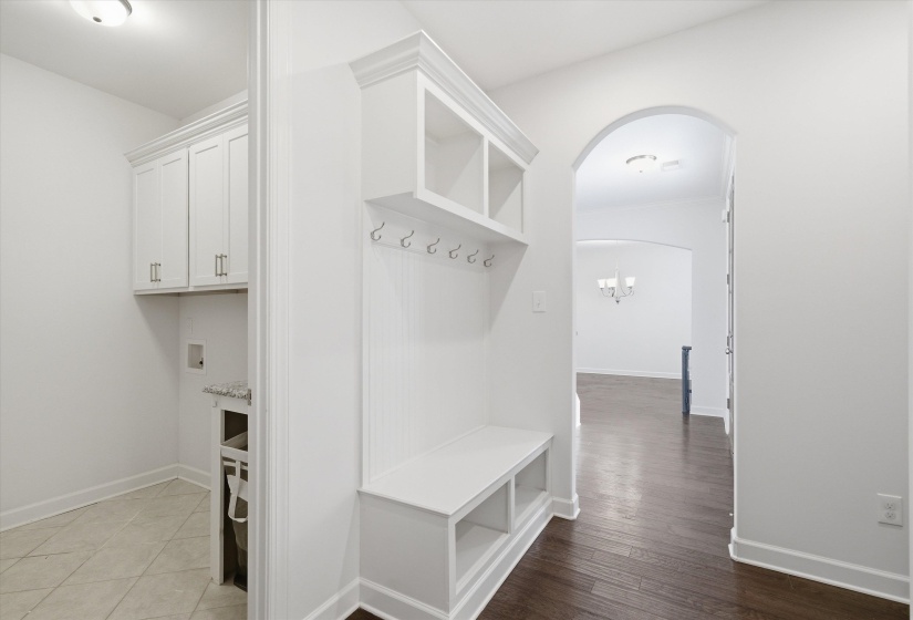 Built-in mudroom bench with cubby storage and coat hooks