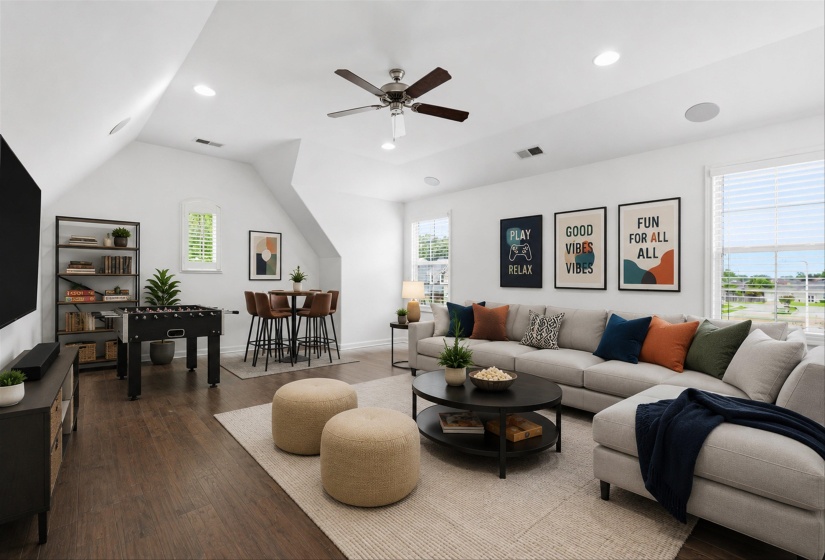 Spacious bonus room featuring wood-finish flooring, recessed lighting, and a ceiling fan