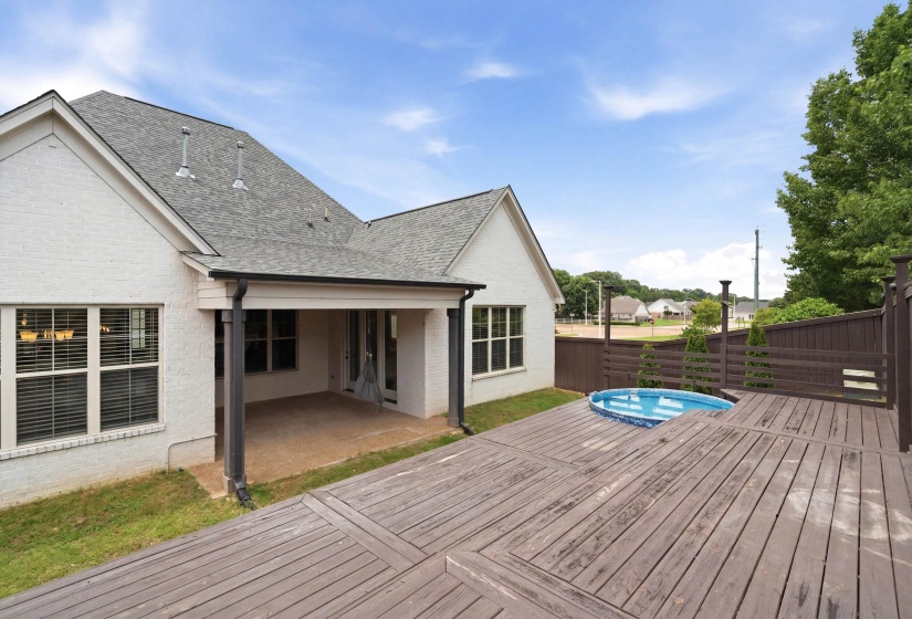 Expansive multi-level wood-finish deck featuring an integrated plunge pool