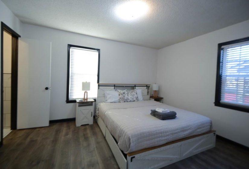 Room featuring wood-finish flooring and white walls