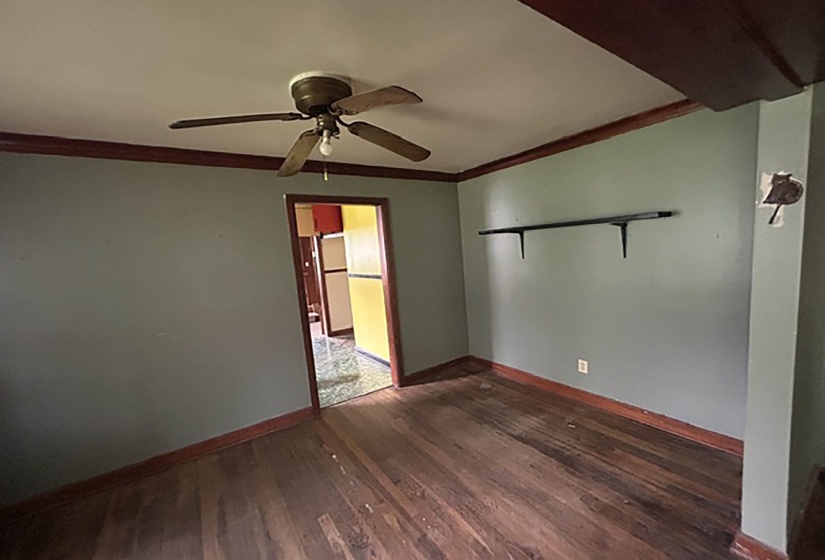 Hardwood flooring featuring a dark wood stain