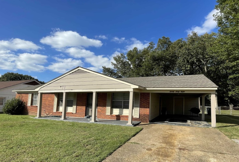Brick facade residence featuring a covered front porch with column supports