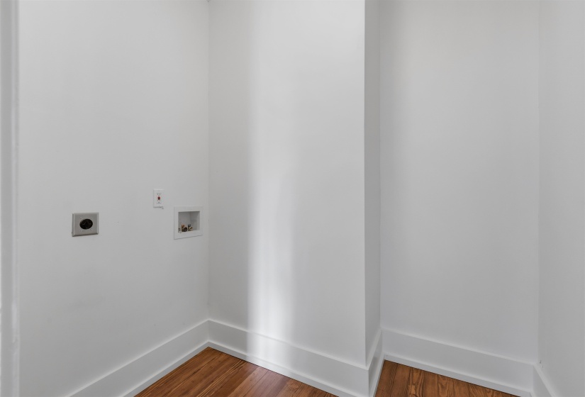 Dedicated laundry area featuring a dryer vent, electrical outlet, and washer hookups