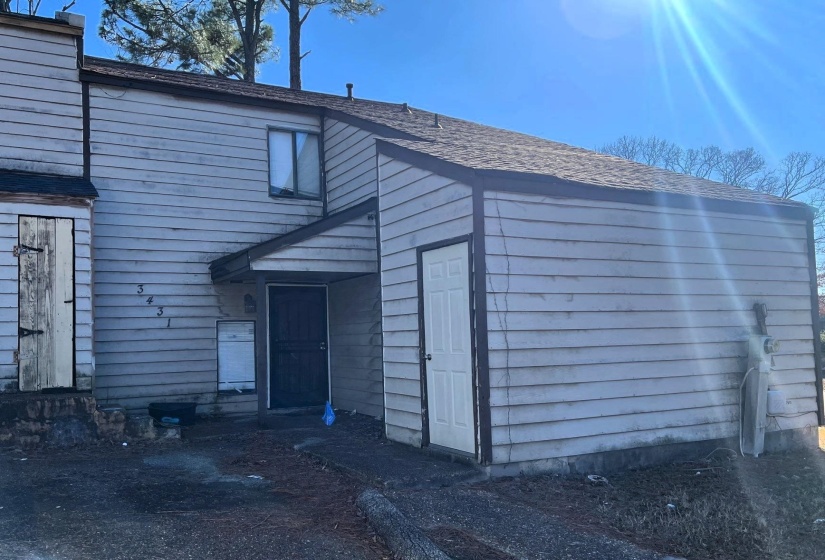 Multi-level exterior featuring horizontal siding, a gabled roofline, and a covered entry