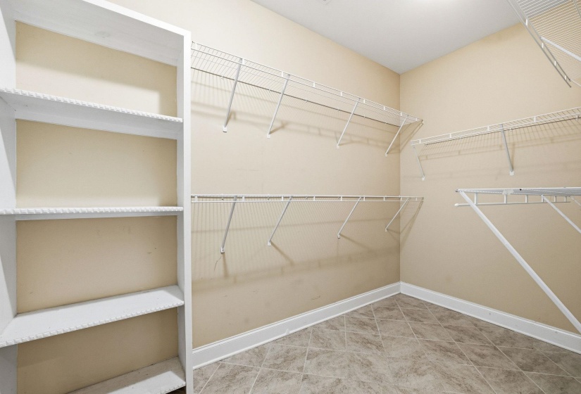 Dedicated storage room featuring tile flooring and neutral wall tones