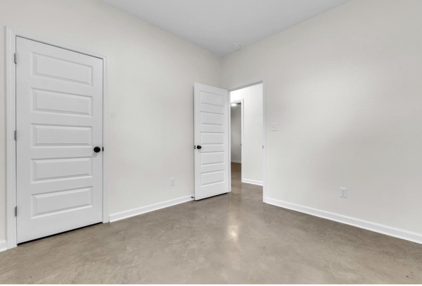 Interior room featuring light gray flooring and white walls