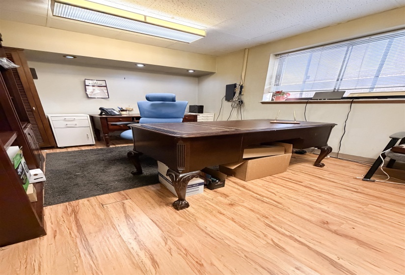 Office area featuring light wood-style flooring