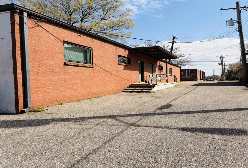 View of side of home featuring brick siding