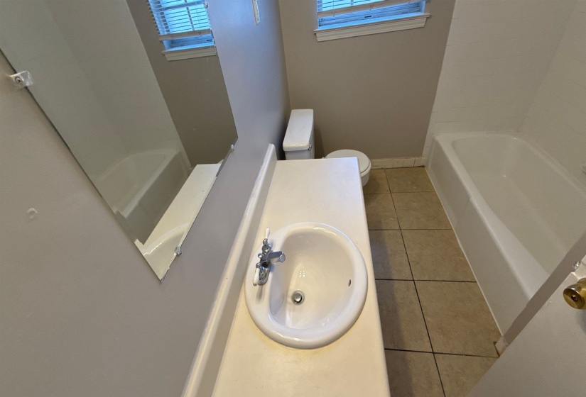 Vanity with integrated sink and chrome faucet