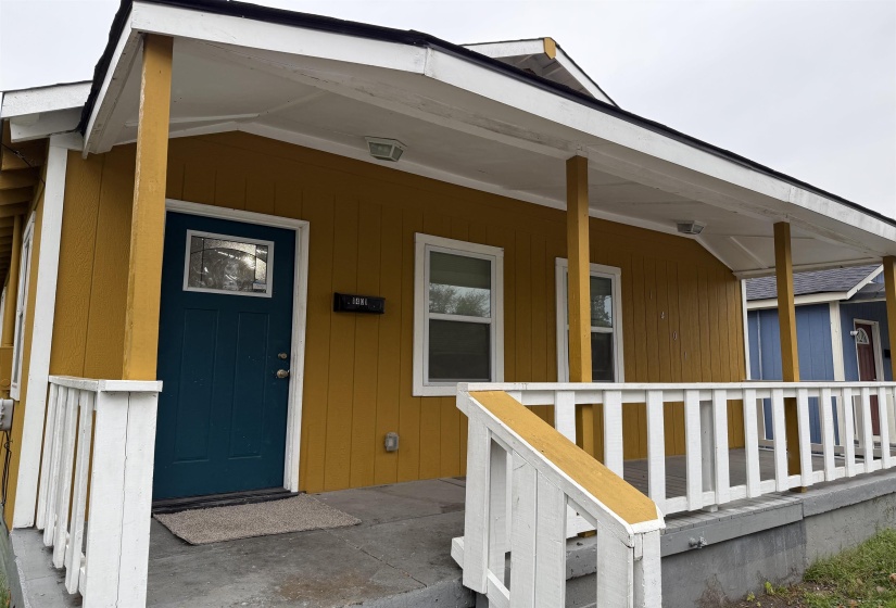 Property entrance featuring covered porch
