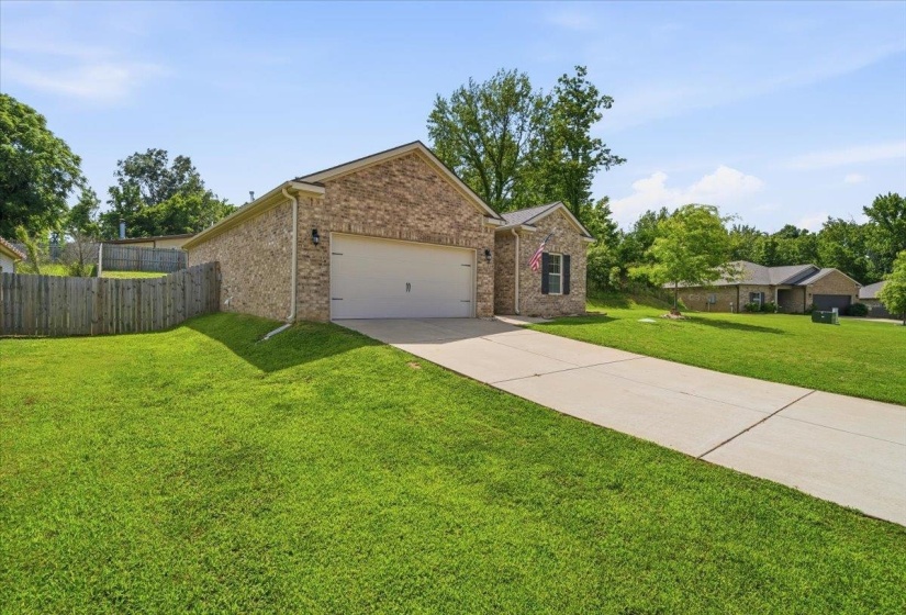 Brick exterior with an attached two-car garage