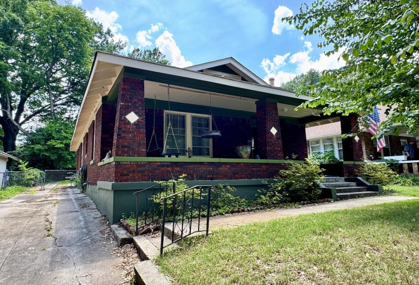 Brick exterior with a covered front porch featuring square columns