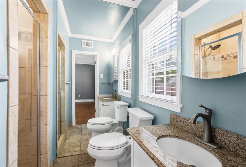 Master bath with taller granite counter top and walk-in tiled shower.