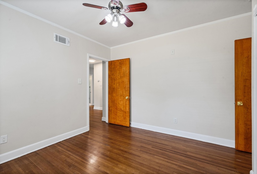 Middle bedroom has original hardwood floors and smooth ceilings.