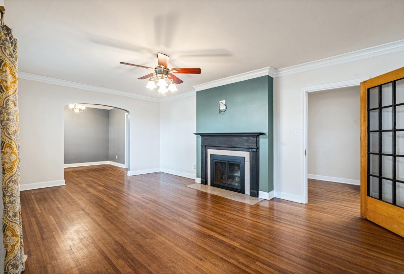 Fireplace with gas logs, marble surround and gorgeous hardwood floors.