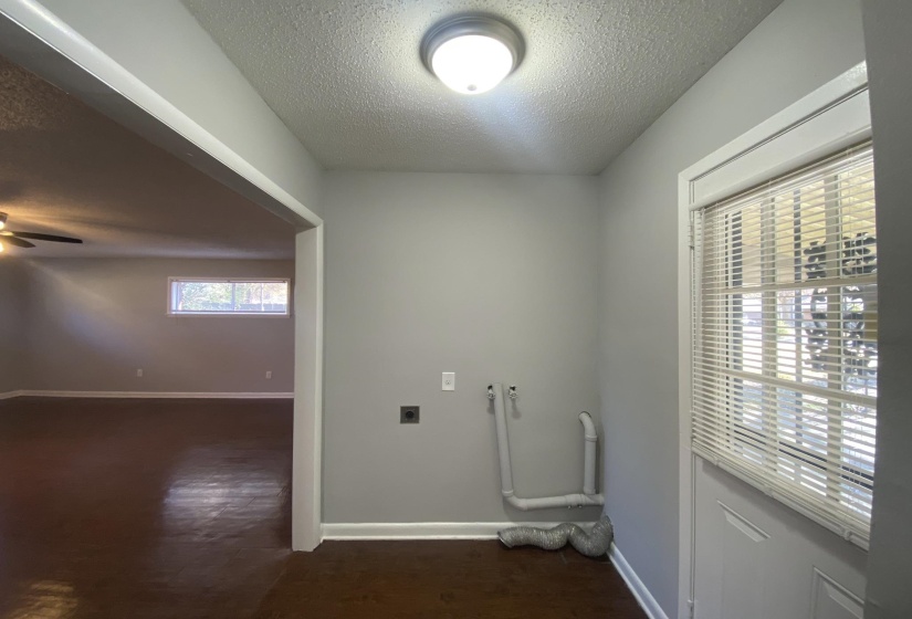 Dedicated utility area with durable flooring and overhead lighting