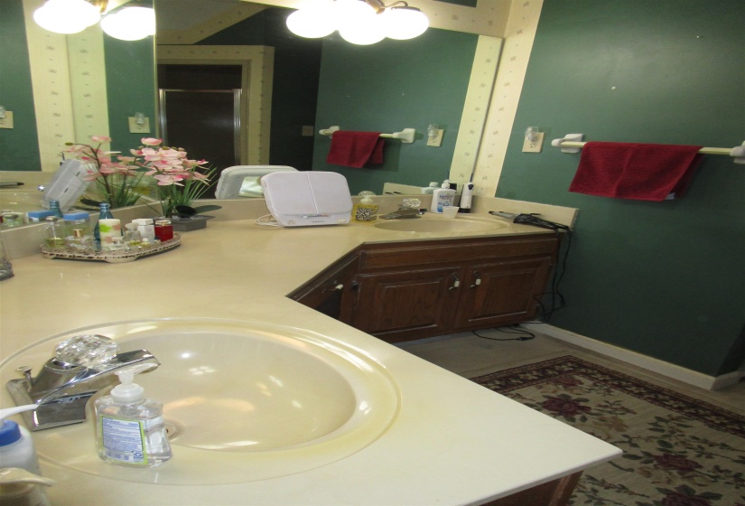 Dual vanity with integrated sinks and chrome fixtures Loads of Mirrors to see easy and get ready