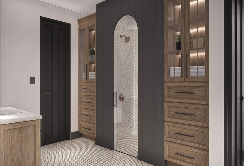 Arch-top glass-enclosed shower with herringbone tile surround and brass fixtures