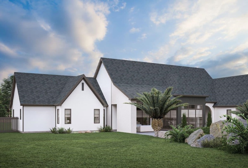 Contemporary architecture featuring a white facade, dark gray asphalt shingle roof, dark-framed windows, a large rear patio, and a landscaped garden area with mature plantings