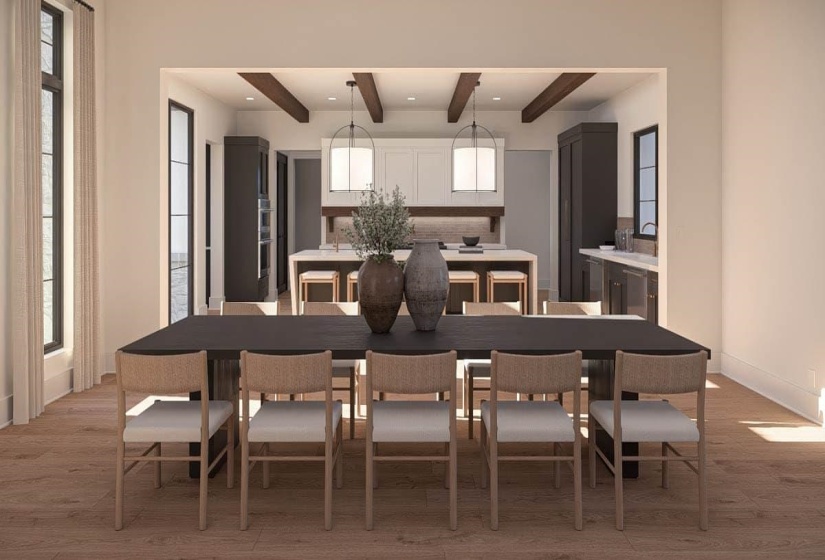Open-concept dining area featuring wood-finish flooring, a large dark wood dining table, and direct access to the kitchen