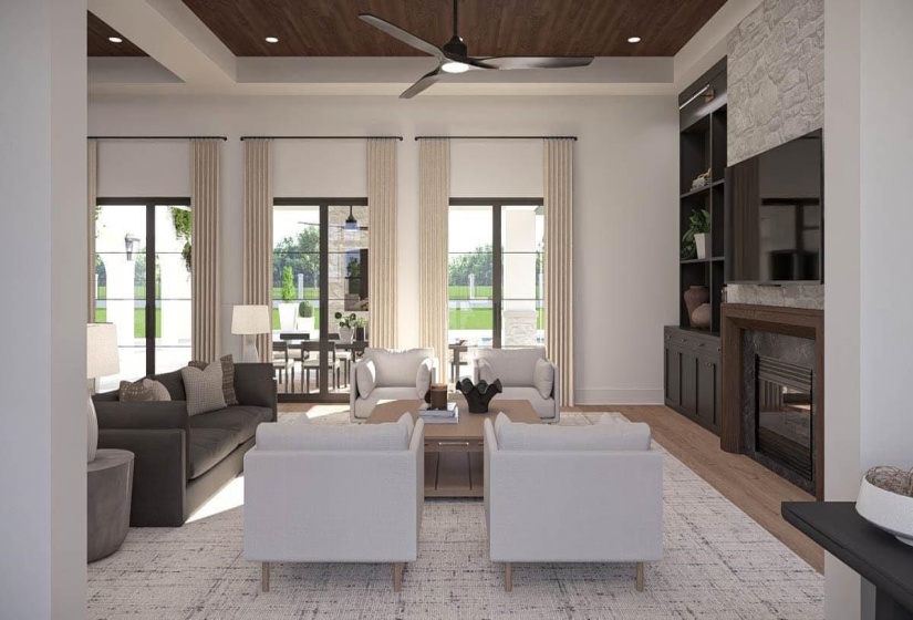 Spacious living area featuring a wood-finish ceiling, multiple floor-to-ceiling windows, a built-in fireplace with a stone surround, an integrated media cabinet, and light wood-finish flooring