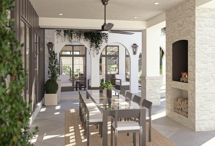 Covered patio with a stone-clad outdoor fireplace and built-in wood storage
